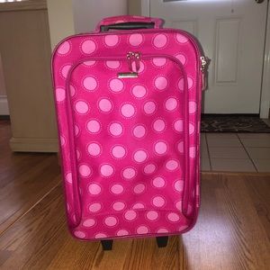 small pink luggage